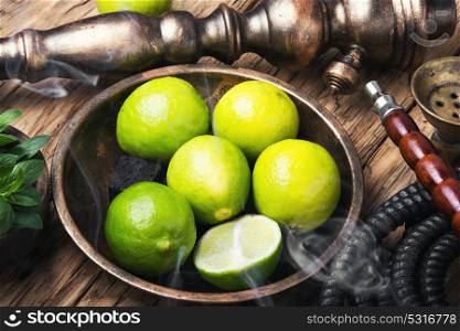 exotic nargile with lime. Arabic hookah with a tobacco flavor of a mixture of lime and peppermint