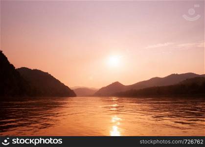 Exotic warm peaceful Mae khong river sunset with mountain view in Luang Prabang - Laos