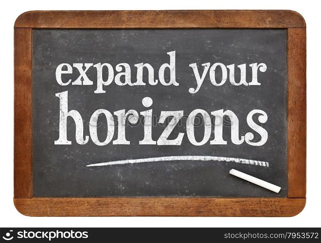 Expand your horizons - motivational text on a vintage slate blackboard