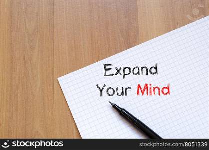 Expand your mind text concept write on notebook