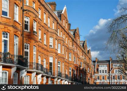 Expensive Edwardian block of period red brick apartments typically found in Kensington, West London, UK. Expensive Edwardian block of period red brick apartments typically found in Kensington, West London, UK.