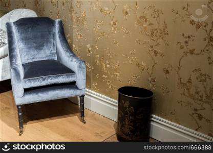 Expensive Vinrage Armchair in Gold Wallpapered Room