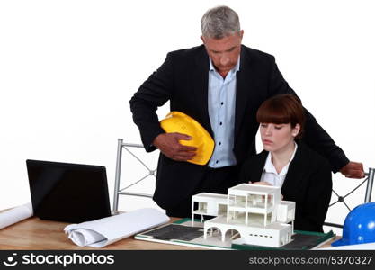 Experienced architect giving a young colleague advice