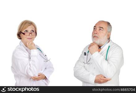 Experienced team of doctors thinking isolated on white background