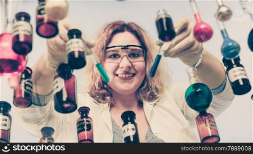 Experiment, research in progress. Chemist woman or student girl, laboratory assistant or scientific researcher with chemical glassware test flask, vintage filter