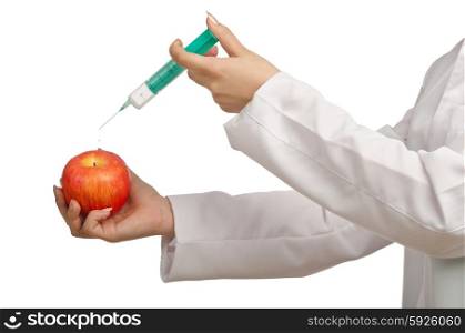 Experiment with apple and syringe on white