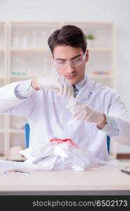 Expert criminologist working in the lab for evidence