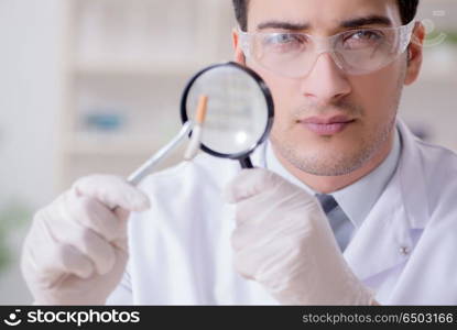 Expert criminologist working in the lab for evidence