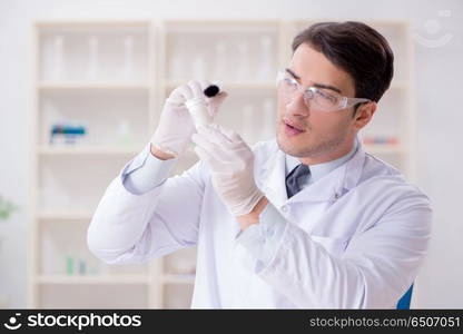 Expert criminologist working in the lab for evidence