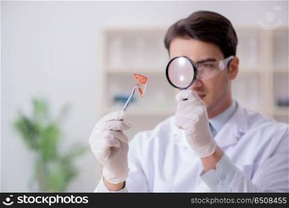 Expert criminologist working in the lab for evidence