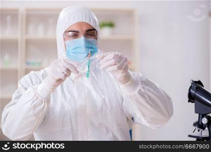 Expert criminologist working in the lab for evidence