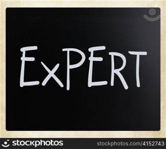 ""Expert" handwritten with white chalk on a blackboard"