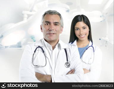 expertise gray hair doctor beautiful nurse in hospital white corridor