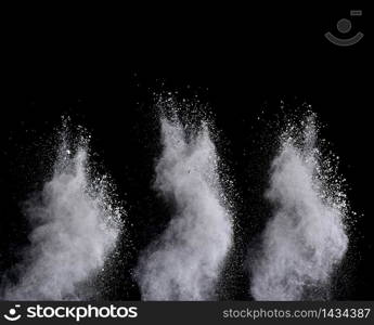 Explosion of white powder isolated on black background. Abstract colored background. holi festival.