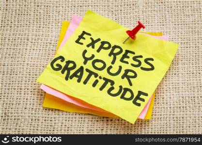 express your gratitude - advice on a sticky note against burlap canvas