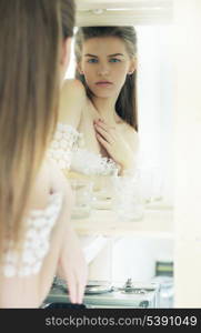 Expression. Candid Genuine Pensive Woman Reflects in Mirror