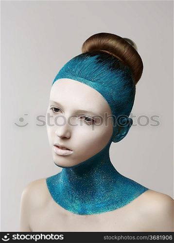 Expression. Fantasy. Eccentric Woman with Blue Painted Skin and Hair. Coloring