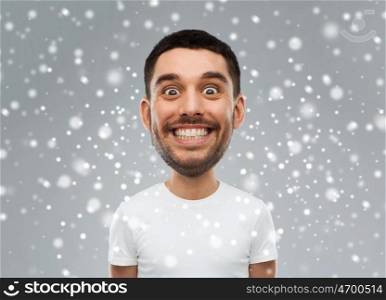 expression, winter, christmas and people concept - smiling man with funny face over snow on gray background (cartoon style character with big head)