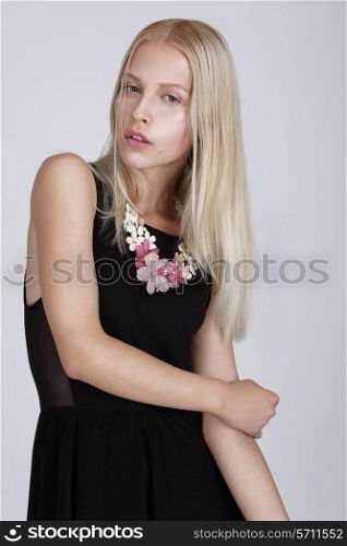 Exquisite Blond Woman with Flowery Necklace