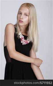 Exquisite Blond Woman with Flowery Necklace