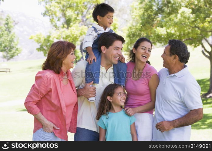 Extended family at the park smiling