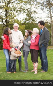 Extended Family Group On Walk Through Countryside