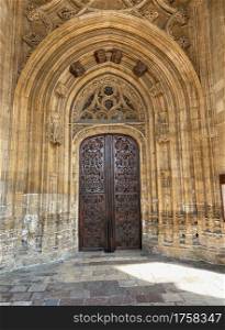 Exterior door and great portico with arches of landmark cathedral of San Salvador, gothic monument from thirteenth century, in Oviedo city, Asturias, Spain, Europe.