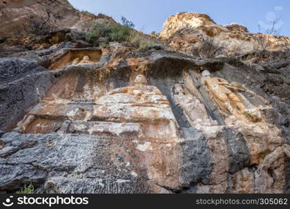 Exterior facade view of Adamkayalar,literally means man-rocks which located on top of Toros Mountains in Silifke,Mersin,Turkey.. Exterior facade view of Adamkayalar or man rocks