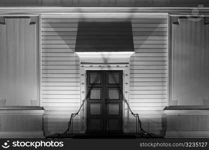 Exterior of wooden housewith light and shadows