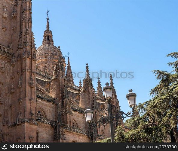 Exterior view of the dome and carvings on the roof of the old Cathedral in Salamanca. Ornate dome on the new Cathedral in Salamanca