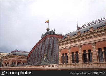 Exterior view of the facade of Atocha train station in Madrid, Spain