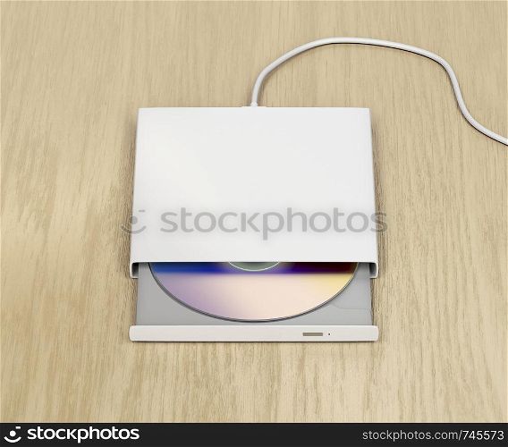 External optical disc drive on wood background
