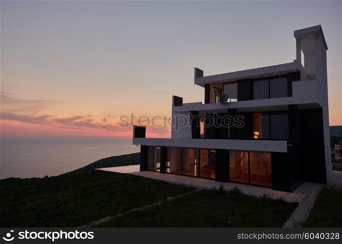 External view of a contemporary house modern villa at sunset