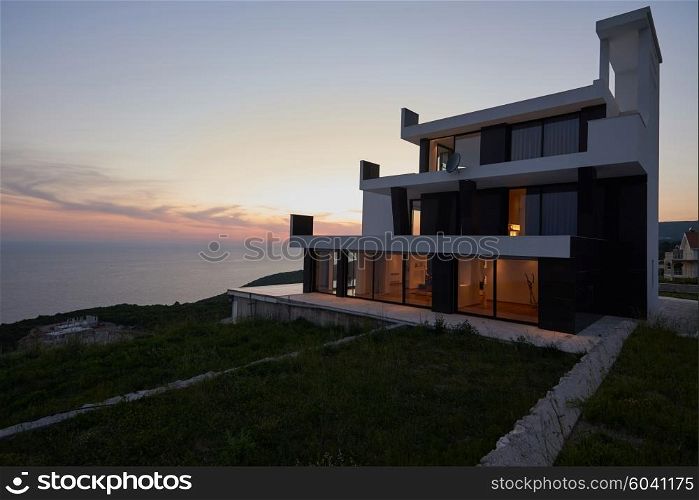 External view of a contemporary house modern villa at sunset