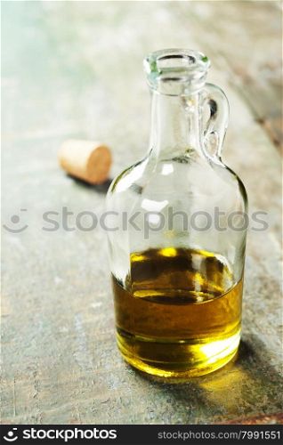 Extra virgin healthy Olive oil on rustic wooden background