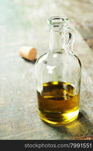 Extra virgin healthy Olive oil on rustic wooden background