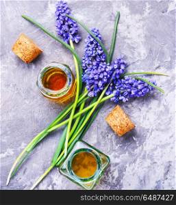 Extraction of flowers hyacinth. Bottle of essential oil with flowers hyacinth.Flower aroma essence