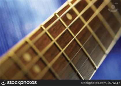 Extreme close-up of guitar bridge