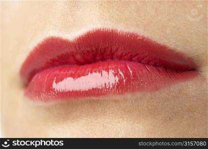 Extreme Close-Up Of Young Woman Wearing Red Lipstick