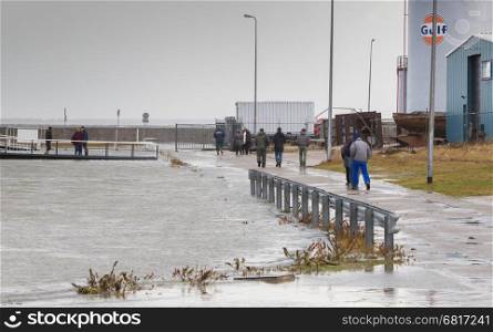 Extreme high tide at the dikes of the dutch coastal works