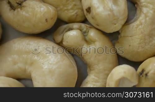 Extreme macro view of Cashew Nuts rotating in loop