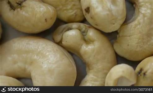 Extreme macro view of Cashew Nuts rotating in loop