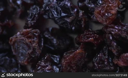 Extreme macro view of grape raisins rotating on camera