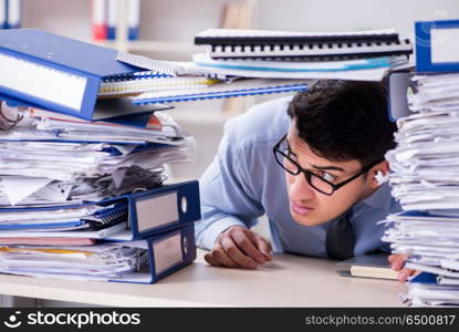 Extremely busy businessman working in office