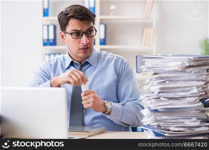 Extremely busy businessman working in office