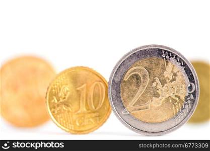 Extremely close up view of Euro currency over a white background