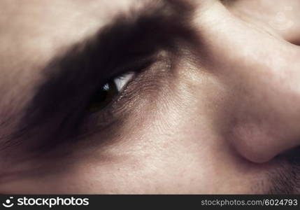 Eye and nose of a young man closeup