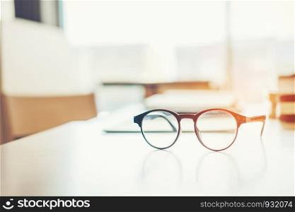 Eye Glasses on the study table education concept