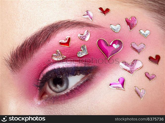 Eye Make-up Girl with a Heart. Valentine&rsquo;s day Makeup. Beauty Fashion. Eyelashes. Cosmetic Eyeshadow. Makeup detail. Creative Woman Holiday make-up