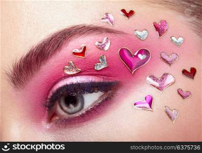 Eye Make-up Girl with a Heart. Valentine&rsquo;s day Makeup. Beauty Fashion. Eyelashes. Cosmetic Eyeshadow. Makeup detail. Creative Woman Holiday make-up